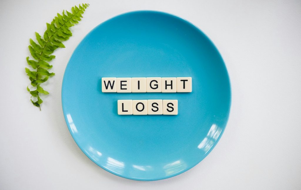 Weight loss spelled out on a plate