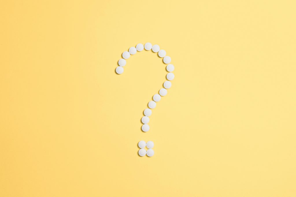 Question mark made of pills